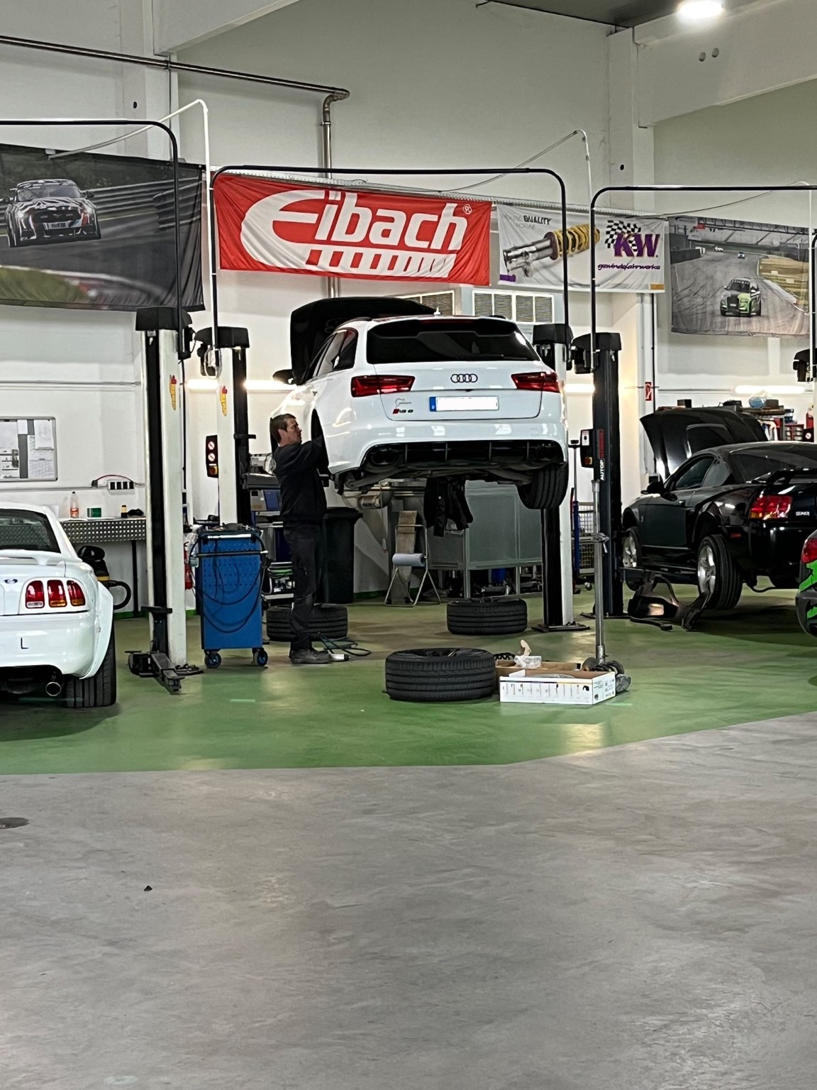 Audi RS6 undergoing suspension work in the Schropp Tuning workshop